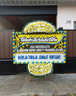 Papan Bunga Duka di Woloan Tiga